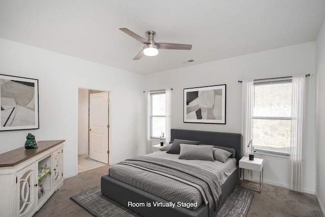 carpeted bedroom with ceiling fan