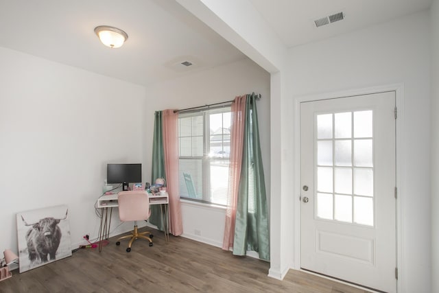 doorway to outside featuring hardwood / wood-style flooring