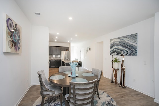 dining area with dark wood-type flooring