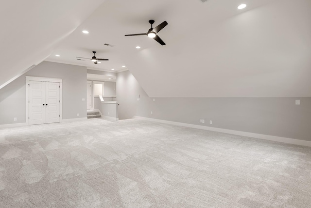 additional living space with light carpet, ceiling fan, and lofted ceiling