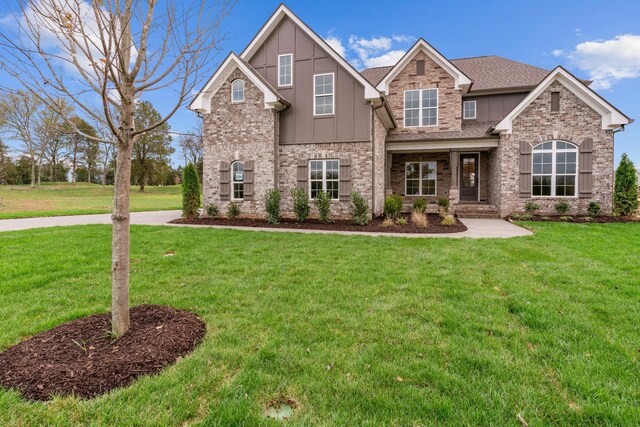 craftsman inspired home with a front yard