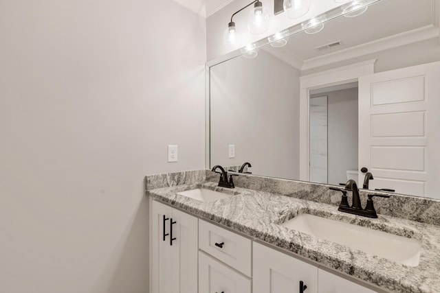 bathroom featuring vanity and ornamental molding