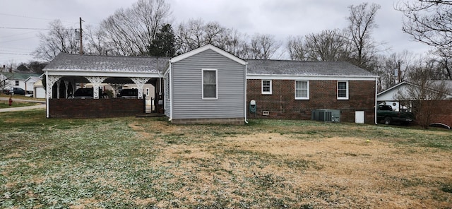 view of property exterior featuring a lawn and cooling unit