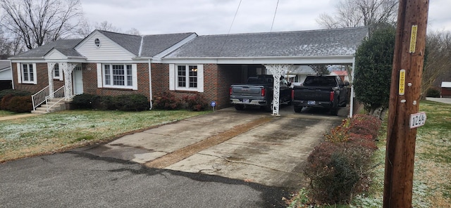 ranch-style home featuring a front yard and a carport