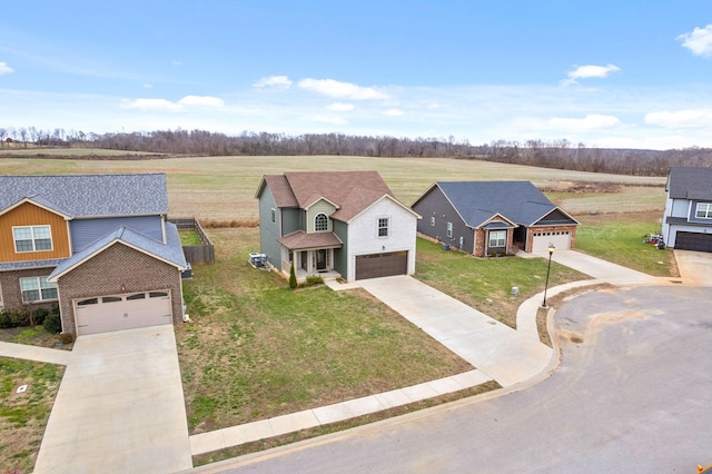 view of front of home featuring a front lawn and a garage