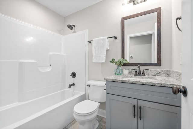 full bathroom featuring vanity, bathtub / shower combination, and toilet