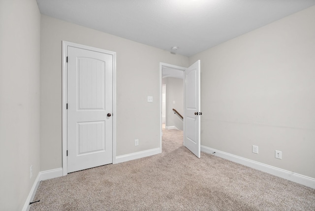 unfurnished bedroom with light carpet