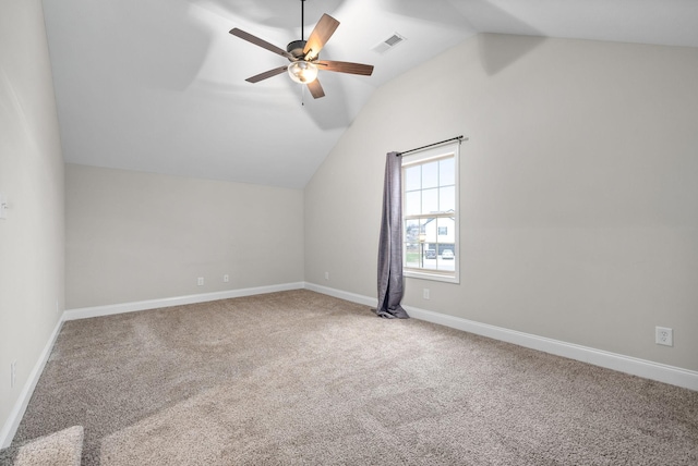 additional living space with carpet flooring, ceiling fan, and lofted ceiling