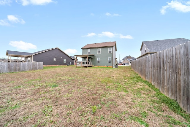 view of yard with a wooden deck