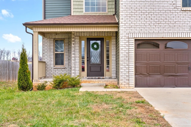 doorway to property with covered porch and a garage