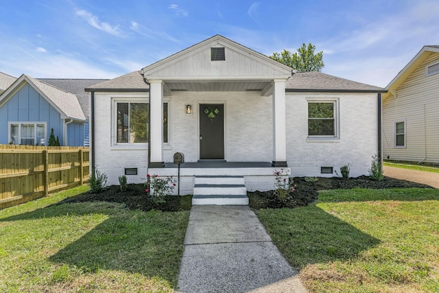 view of front of house featuring a porch and a front lawn