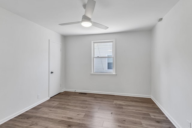 unfurnished room with ceiling fan and light hardwood / wood-style flooring