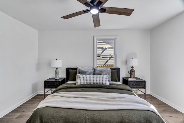 bedroom featuring dark hardwood / wood-style flooring and ceiling fan