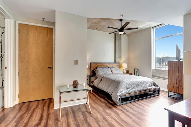 bedroom featuring ceiling fan and dark wood-type flooring