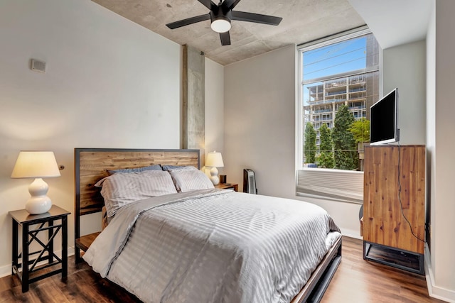 bedroom with wood-type flooring and ceiling fan