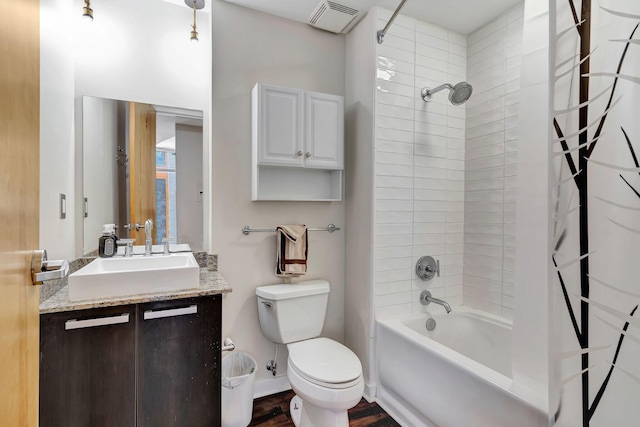 full bathroom featuring hardwood / wood-style flooring, shower / bath combo with shower curtain, vanity, and toilet