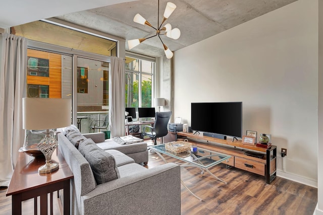 living room with a chandelier and dark hardwood / wood-style flooring