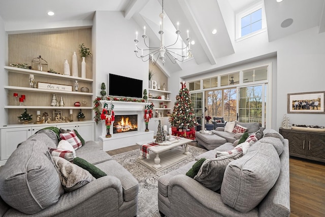 living room with high vaulted ceiling, built in features, a notable chandelier, beamed ceiling, and hardwood / wood-style floors