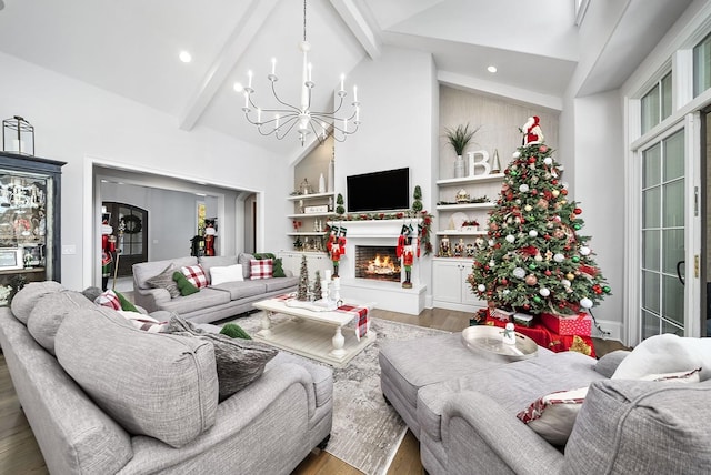 living room with hardwood / wood-style floors, beam ceiling, high vaulted ceiling, and a chandelier