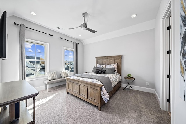 bedroom with ceiling fan, carpet floors, and vaulted ceiling