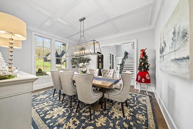 dining room featuring coffered ceiling, crown molding, a chandelier, beamed ceiling, and dark hardwood / wood-style floors