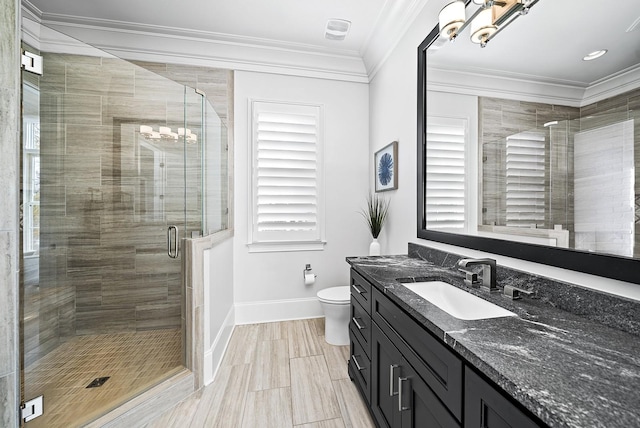 bathroom with an enclosed shower, ornamental molding, vanity, a notable chandelier, and toilet