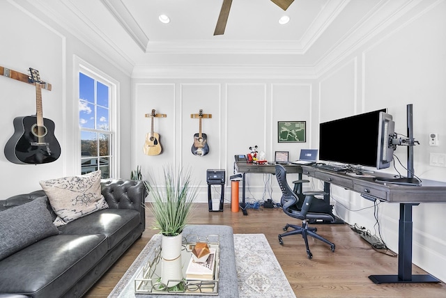 office area featuring wood-type flooring and ornamental molding