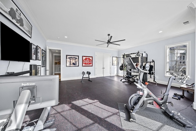 exercise room featuring ceiling fan and ornamental molding