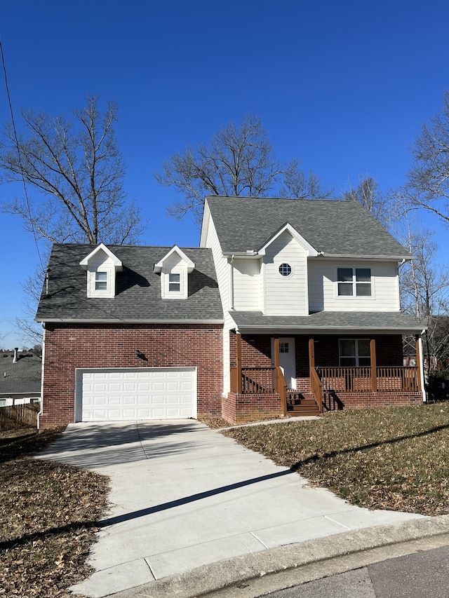 view of front of property with a porch and a garage