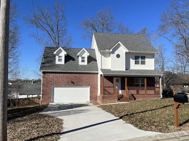 view of front of house with a porch and a garage