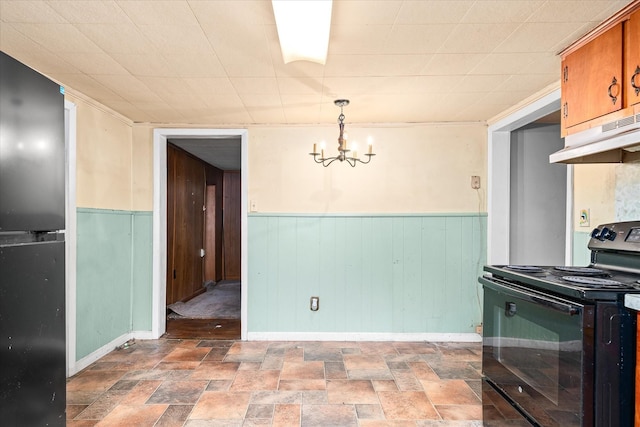 dining area featuring wooden walls and a notable chandelier