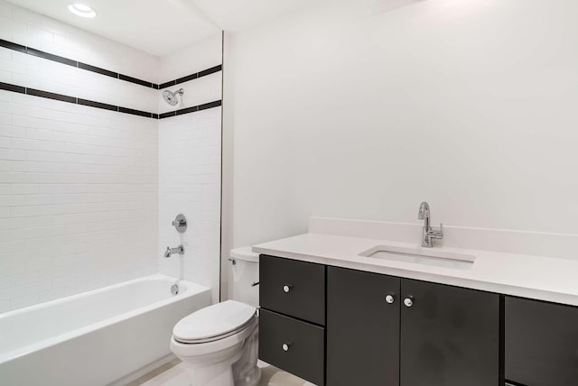 full bathroom featuring vanity, toilet, and tiled shower / bath