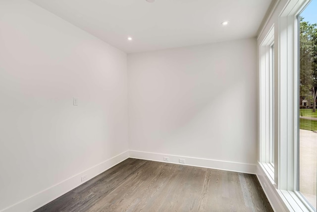 empty room with dark hardwood / wood-style floors