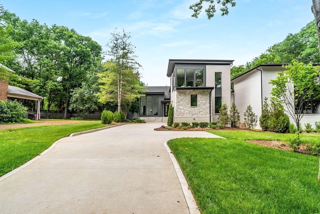 contemporary home with a front yard