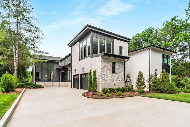 rear view of house featuring a garage