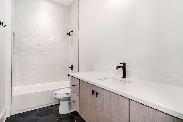 full bathroom with tile patterned flooring, vanity, toilet, and tiled shower / bath