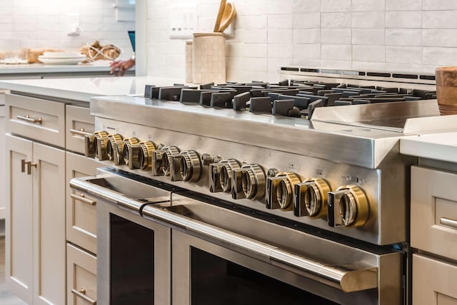 interior details featuring tasteful backsplash and double oven range