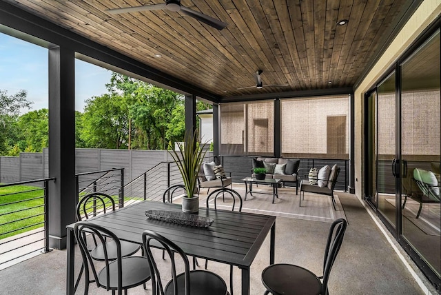 sunroom / solarium with ceiling fan and wooden ceiling