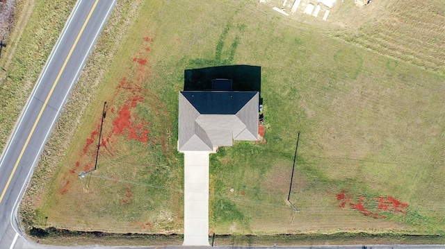 birds eye view of property with a rural view