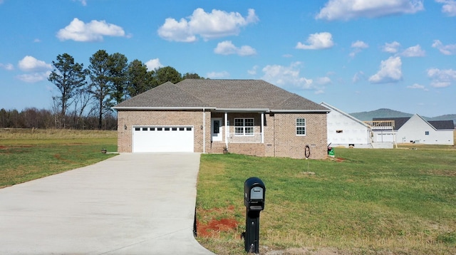 view of front facade with a front lawn and a garage