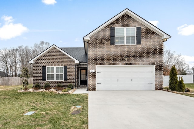 view of property featuring a front yard and a garage