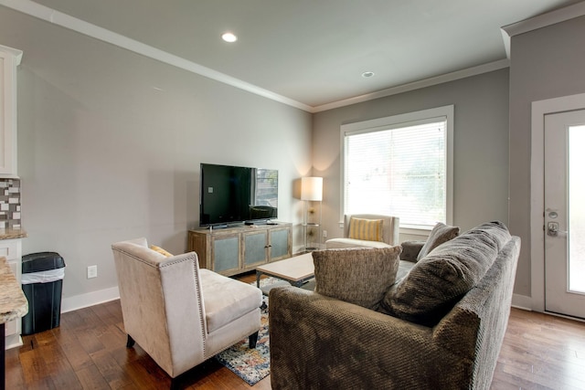 living room featuring wood-type flooring and ornamental molding