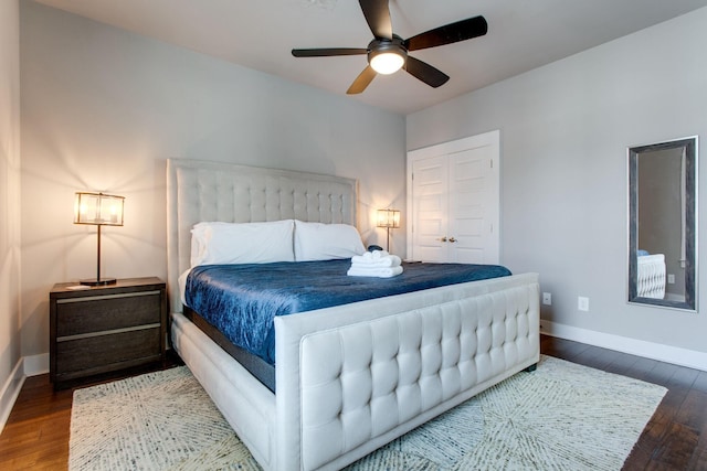 bedroom featuring ceiling fan and dark wood-type flooring