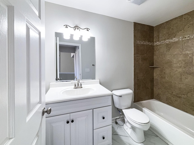 full bathroom featuring vanity, toilet, and tiled shower / bath combo