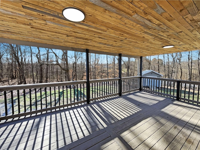 deck featuring an outdoor structure