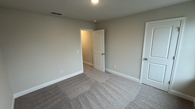 unfurnished bedroom with carpet floors