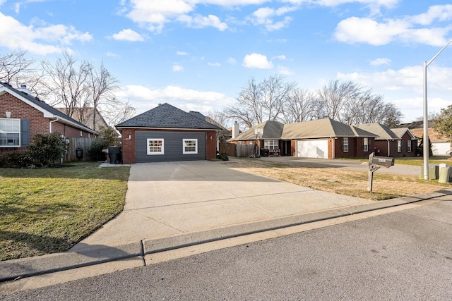 single story home featuring a front lawn