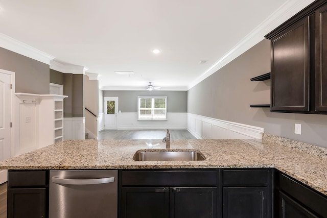 kitchen featuring ceiling fan, dishwasher, sink, light stone counters, and ornamental molding