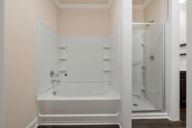 bathroom with hardwood / wood-style floors, ornamental molding, and shower with separate bathtub