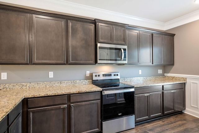 kitchen featuring light stone countertops, dark brown cabinetry, stainless steel appliances, crown molding, and dark hardwood / wood-style floors